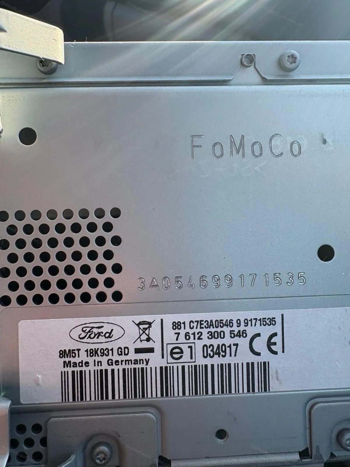 Serial engraved on the casing above the radio label