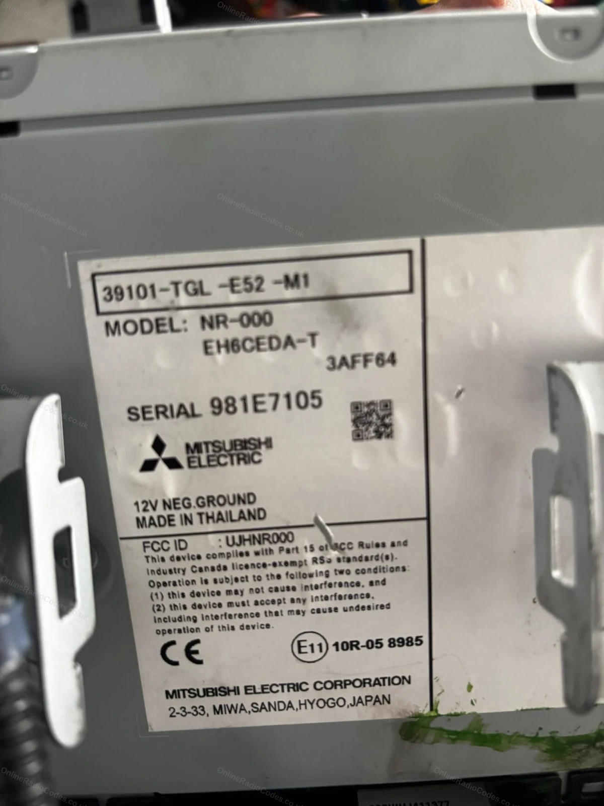 Mitsubishi Electric serial label on the back of a Honda unit