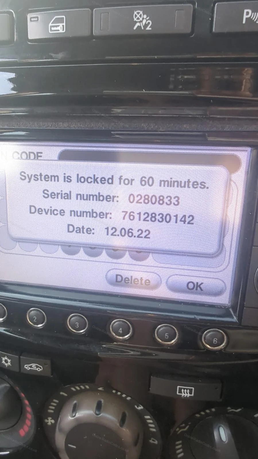 Radio lock screen showing serial, device number and date